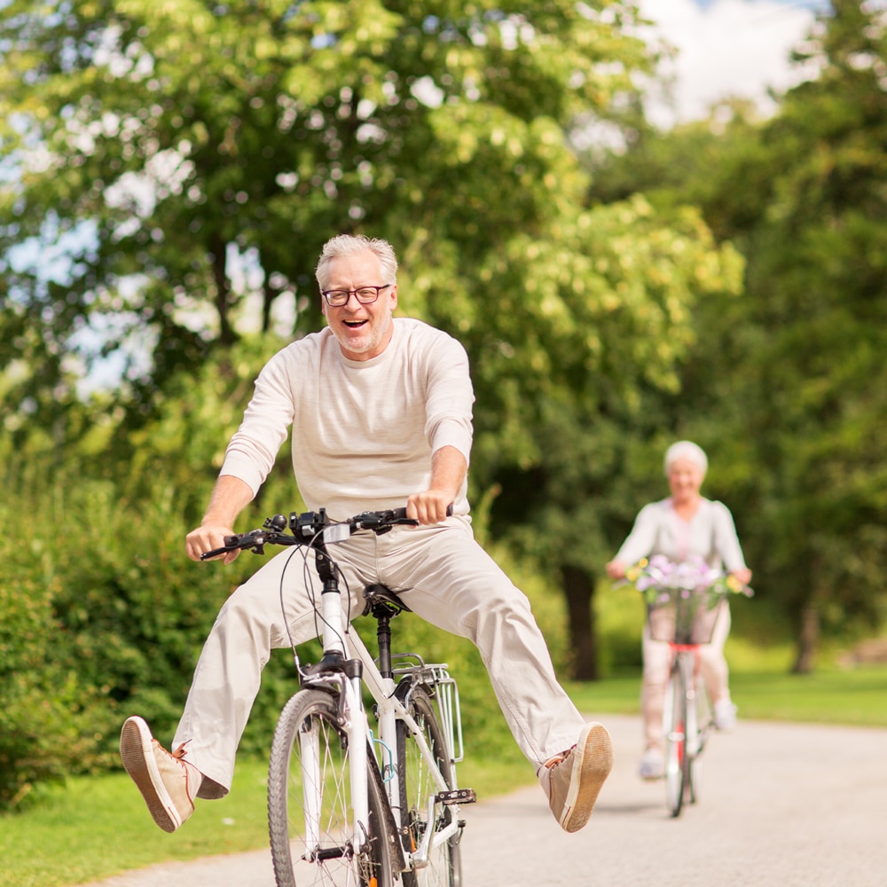 a man riding on the back of a bicycle